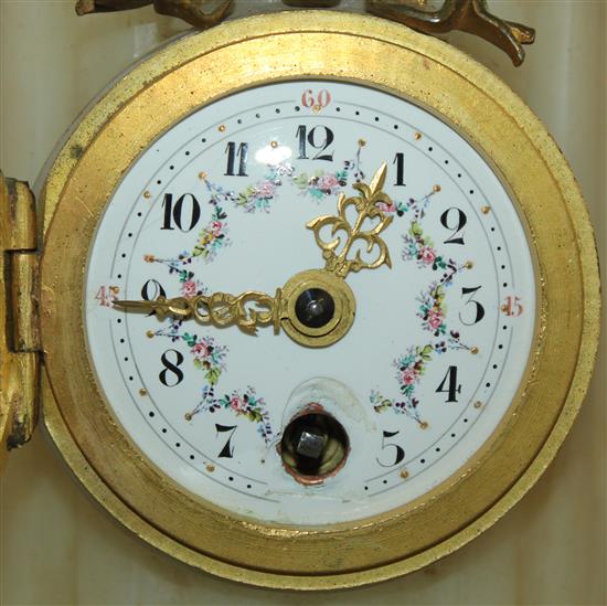 An early 20th century French ormolu mounted alabaster timepiece, 9.5in.